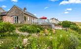 The gorgeous outside terrace has breathtaking views which you can enjoy whilst dining al fresco or lounging in the Devon sunshine. - Thumbnail Image