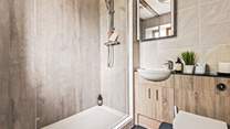 The en suite shower-room to bedroom 2, ideal for rinsing salty toes after a beach day.