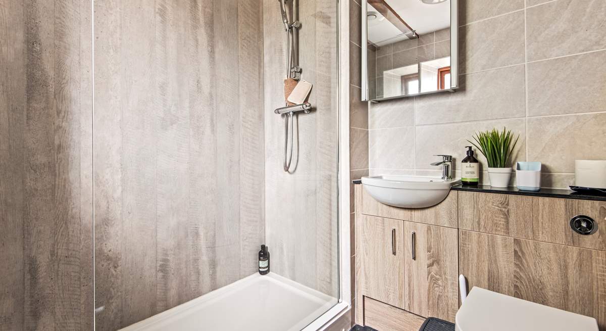 The en suite shower-room to bedroom 2, ideal for rinsing salty toes after a beach day.