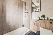 The en suite shower-room to bedroom 2, ideal for rinsing salty toes after a beach day.