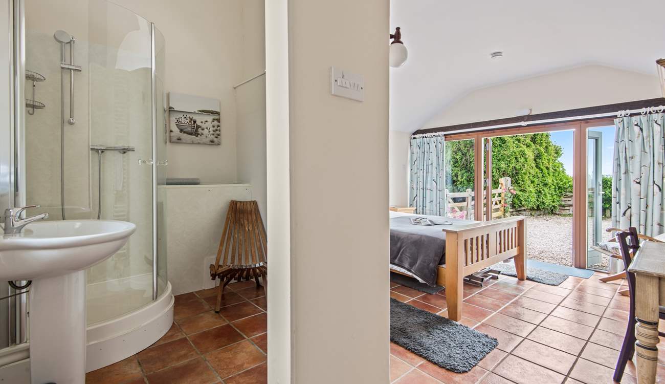 The convenient en suite shower-room for bedroom 1 has a shower and wash-basin but please note there is no WC.
