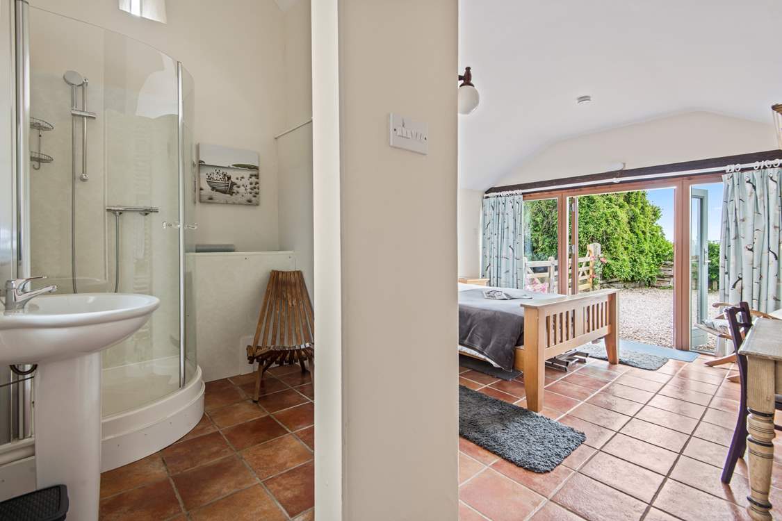 The convenient en suite shower-room for bedroom 1 has a shower and wash-basin but please note there is no WC.