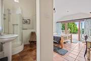 The convenient en suite shower-room for bedroom 1 has a shower and wash-basin but please note there is no WC.