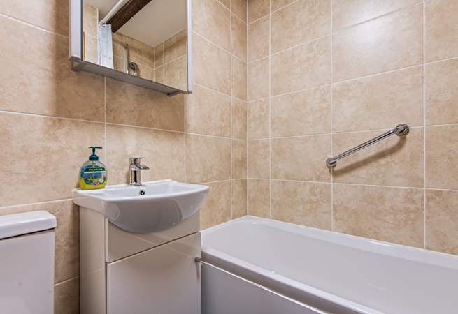 The family bathroom has a bath with shower attachment.