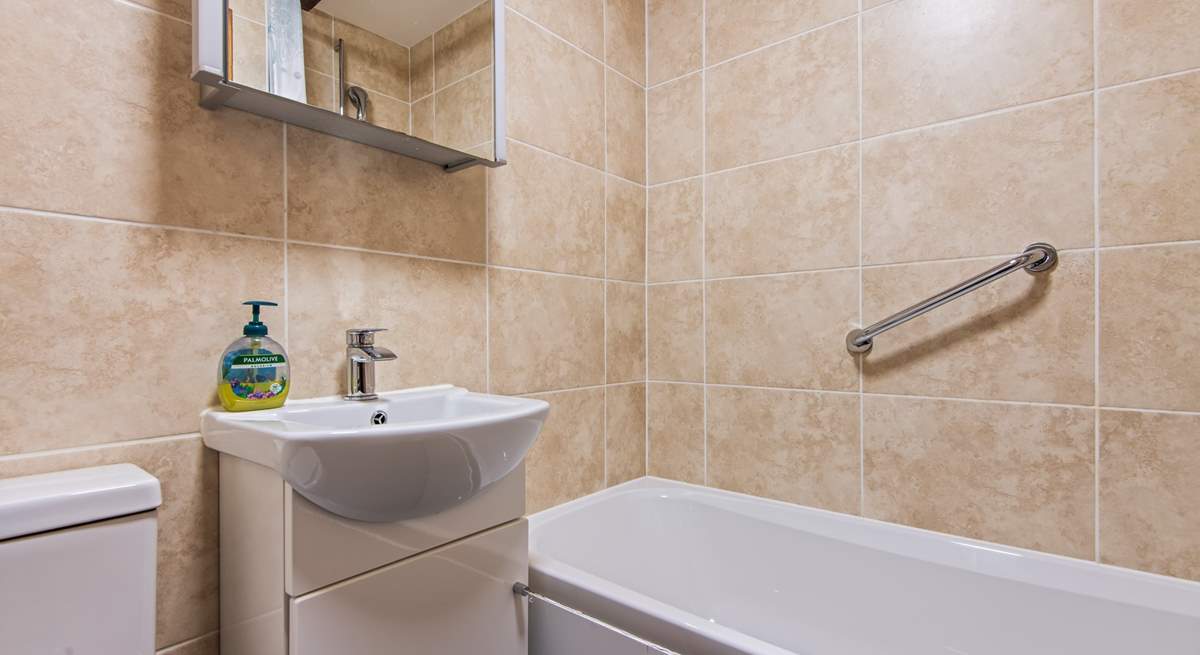 The family bathroom has a bath with shower attachment.