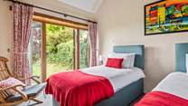 Bedroom 4 also has twin beds and a pretty outlook over the garden.
