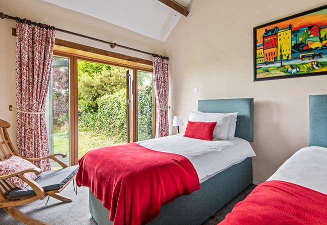 Bedroom 4 also has twin beds and a pretty outlook over the garden.