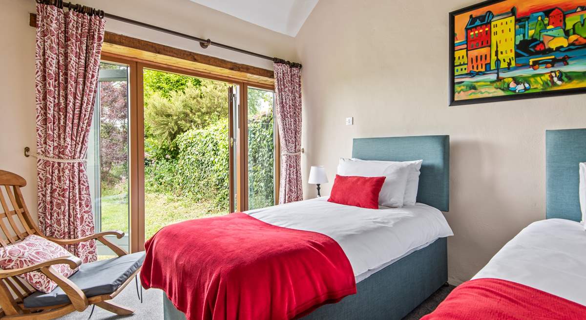 Bedroom 4 also has twin beds and a pretty outlook over the garden.