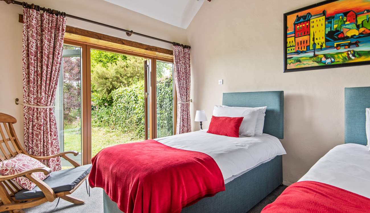 Bedroom 4 also has twin beds and a pretty outlook over the garden.