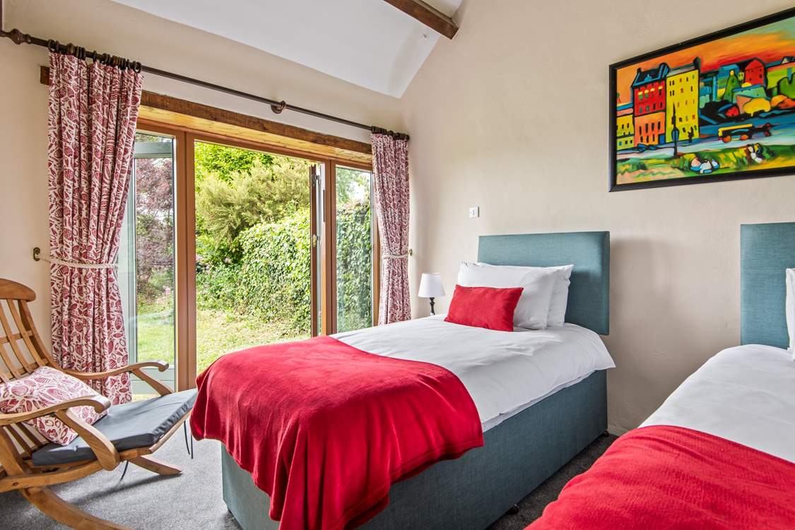 Bedroom 4 also has twin beds and a pretty outlook over the garden.