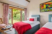 Bedroom 4 also has twin beds and a pretty outlook over the garden.