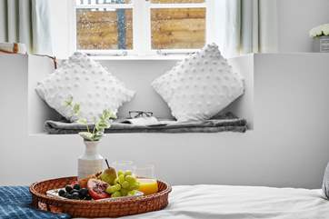 The charming window seat in the double bedroom, the perfect spot for a quiet read.