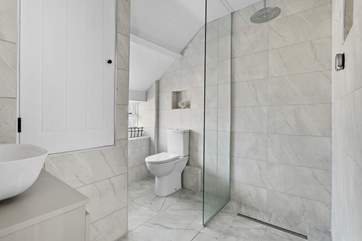 The walk-in shower is perfect for a refreshing shower after a busy day.