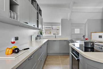 The gorgeous crafted kitchen sits at the rear of the open plan living-room.