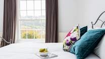 Wake to the crisp morning sun creeping in through the thick velvet curtains.