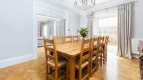 Enjoy social meals together around the beautifully crafted wooden dining-table