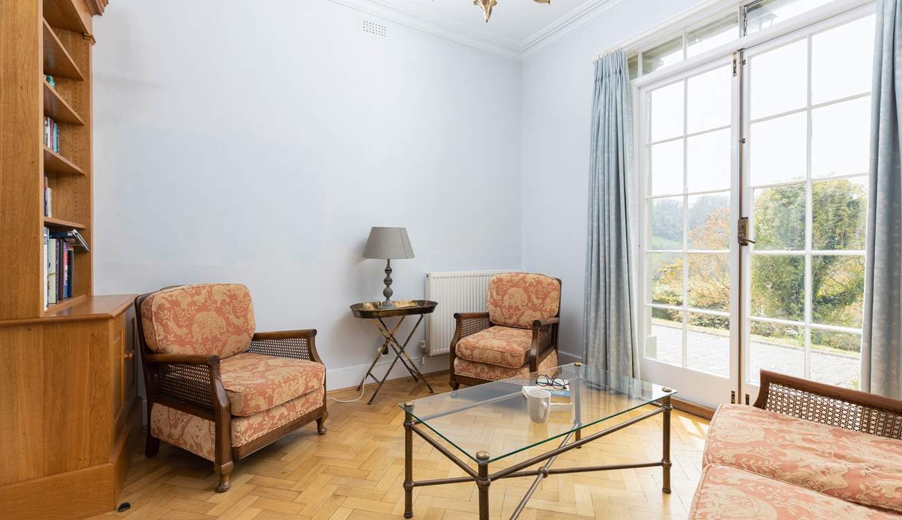 Further down the hall, you'll find the charming snug.