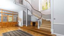 The breathtaking entrance hall greets you as you enter.