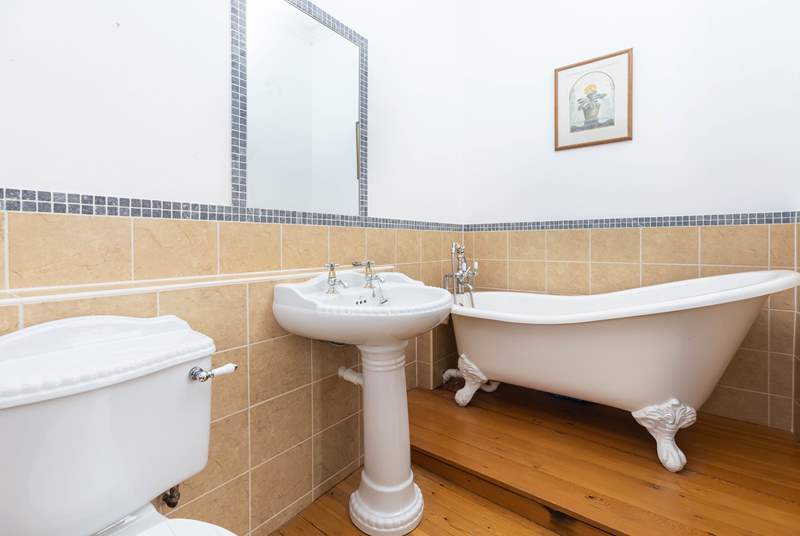 An indulgent free-standing bath sits in the corner of bedroom two's en suite bathroom.