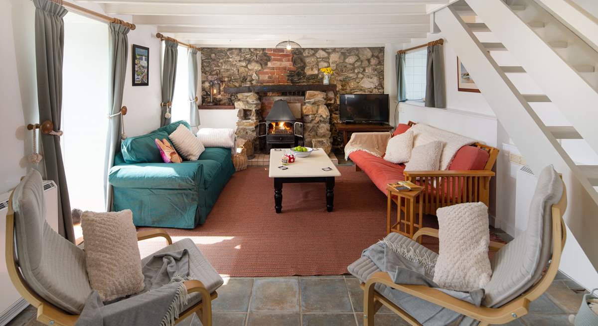 The cosy sitting-room has a wood-burner for chillier evenings.