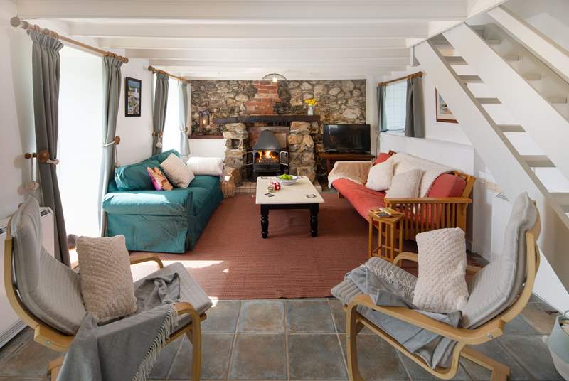 The cosy sitting-room has a wood-burner for chillier evenings.