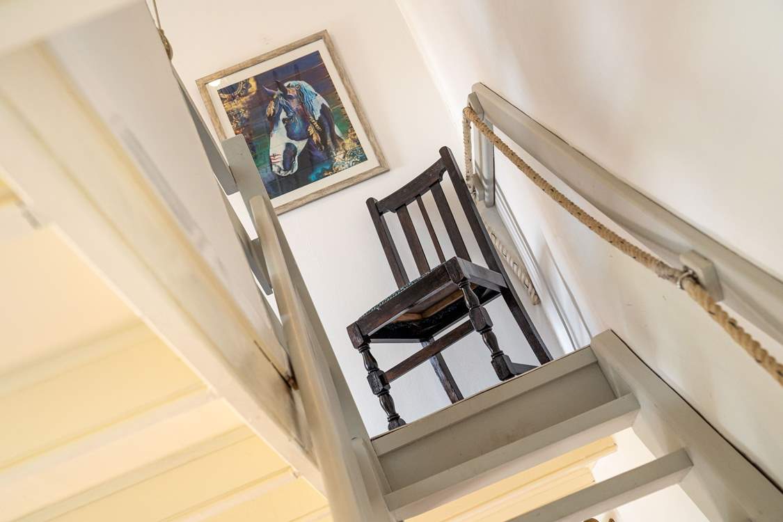 Take great care climbing the wooden hill. (The open tread stairs are wooden, painted  with a banister one side and rope on the other)