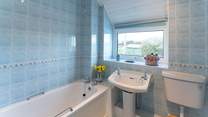 Soak in a warm, bubbly bath after a dip in the sea or a long walk exploring the nearby Coastal Path. 