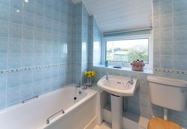 Soak in a warm, bubbly bath after a dip in the sea or a long walk exploring the nearby Coastal Path. 