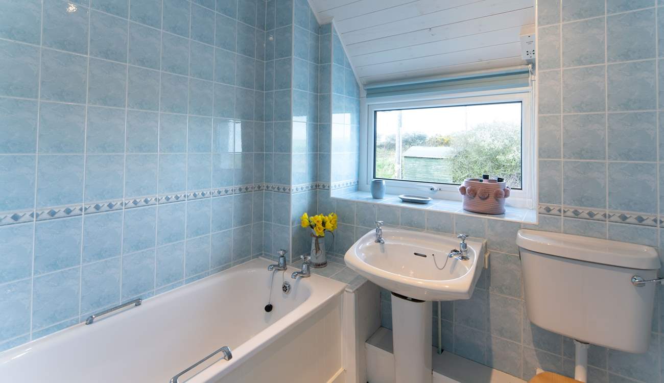 Soak in a warm, bubbly bath after a dip in the sea or a long walk exploring the nearby Coastal Path. 