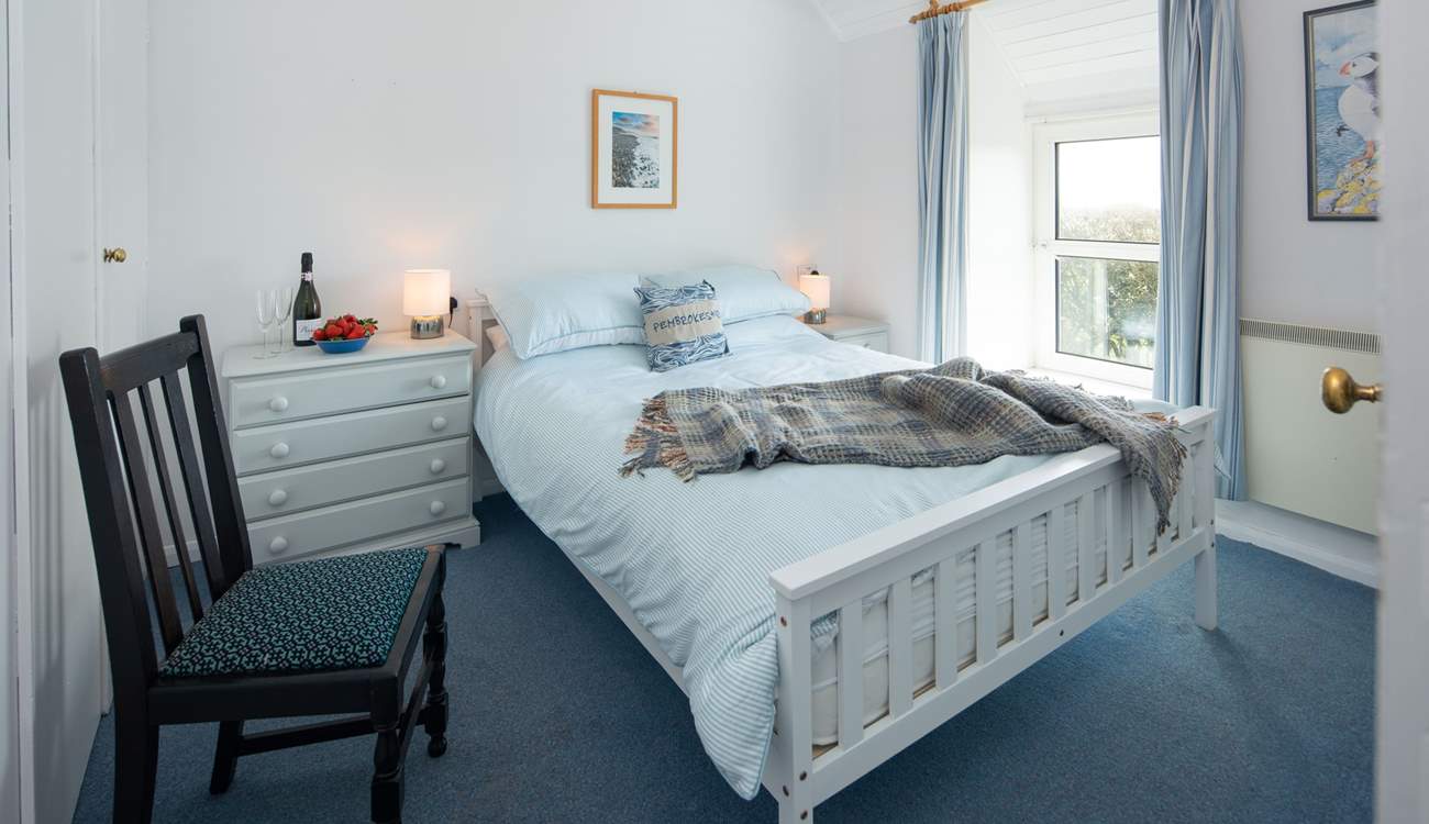 Bedroom 1 is a sweet king room.