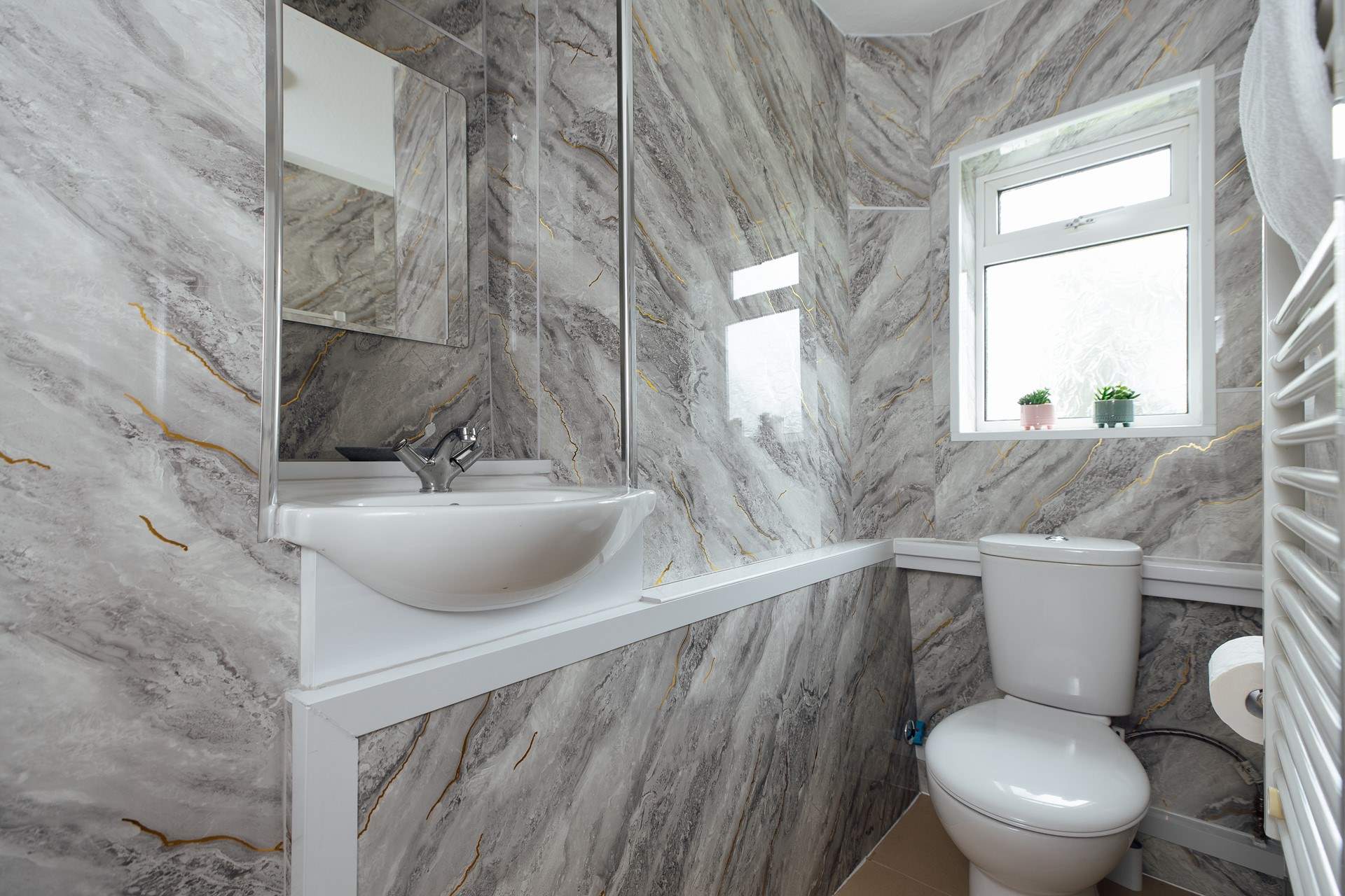 Ideal for sandy toes, the ground floor shower room. 