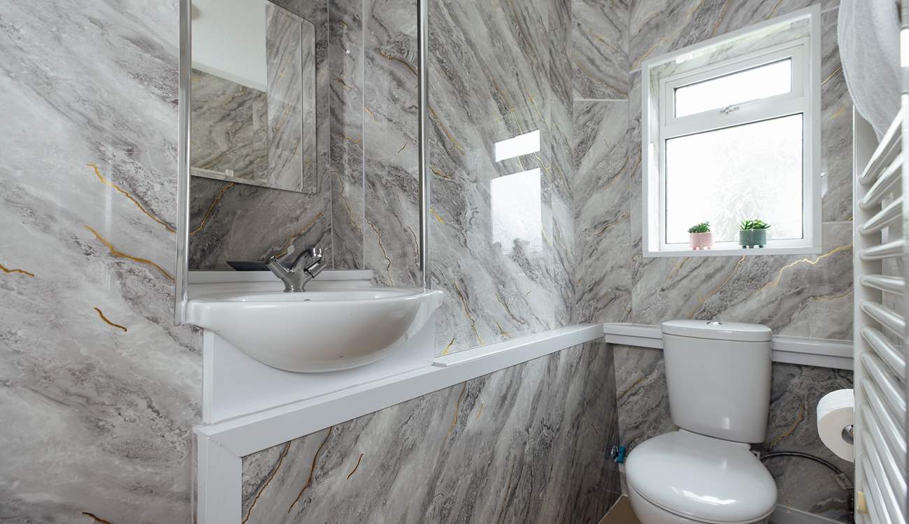 Ideal for sandy toes, the ground floor shower room. 