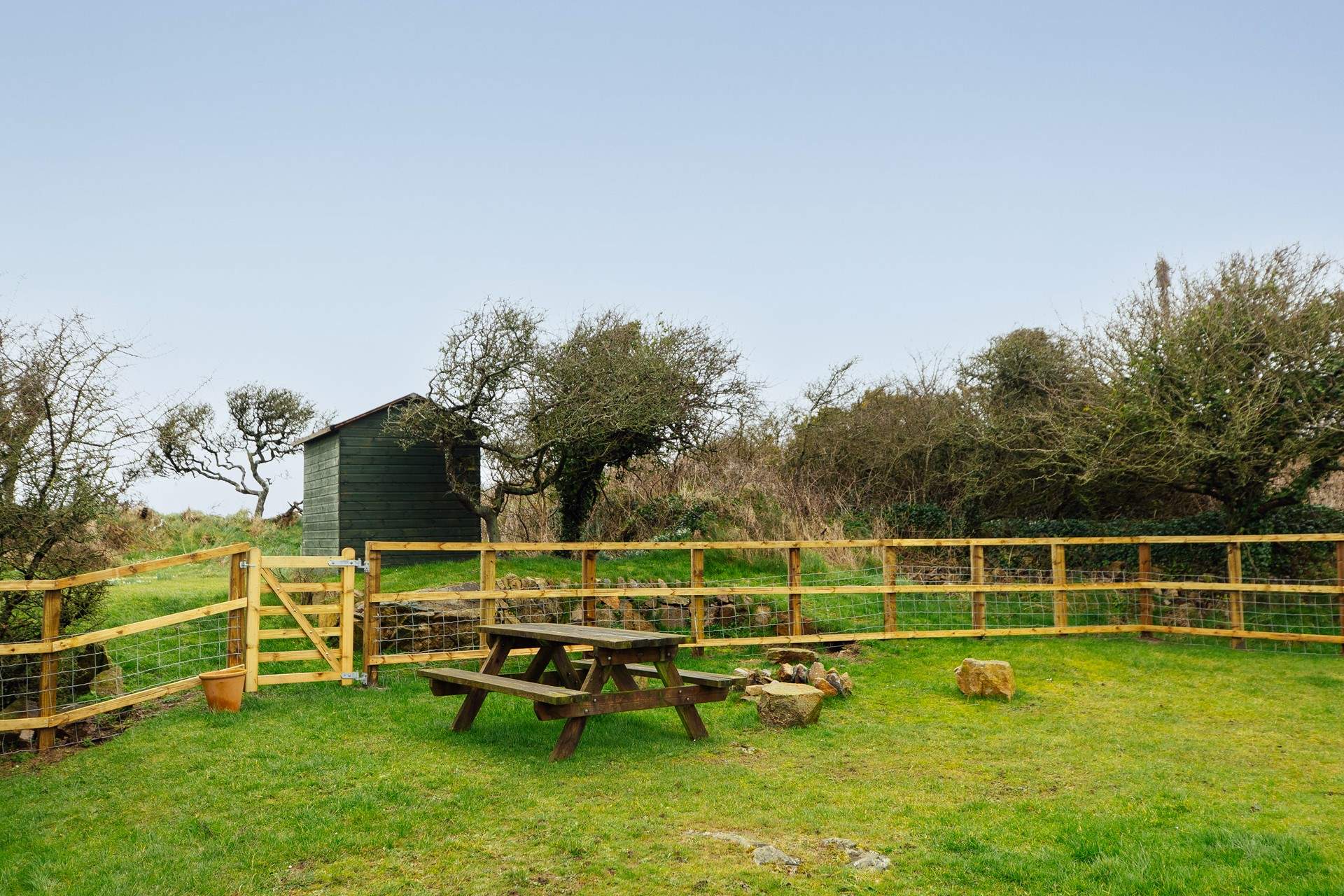 A fenced area, ideal for the dog, who is very welcome to stay at Pops Cottage. With so many beaches and walks nearby, he'll love it here!. 