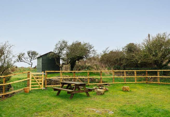 A fenced area, ideal for the dog, who is very welcome to stay at Pops Cottage. With so many beaches and walks nearby, he'll love it here!. 