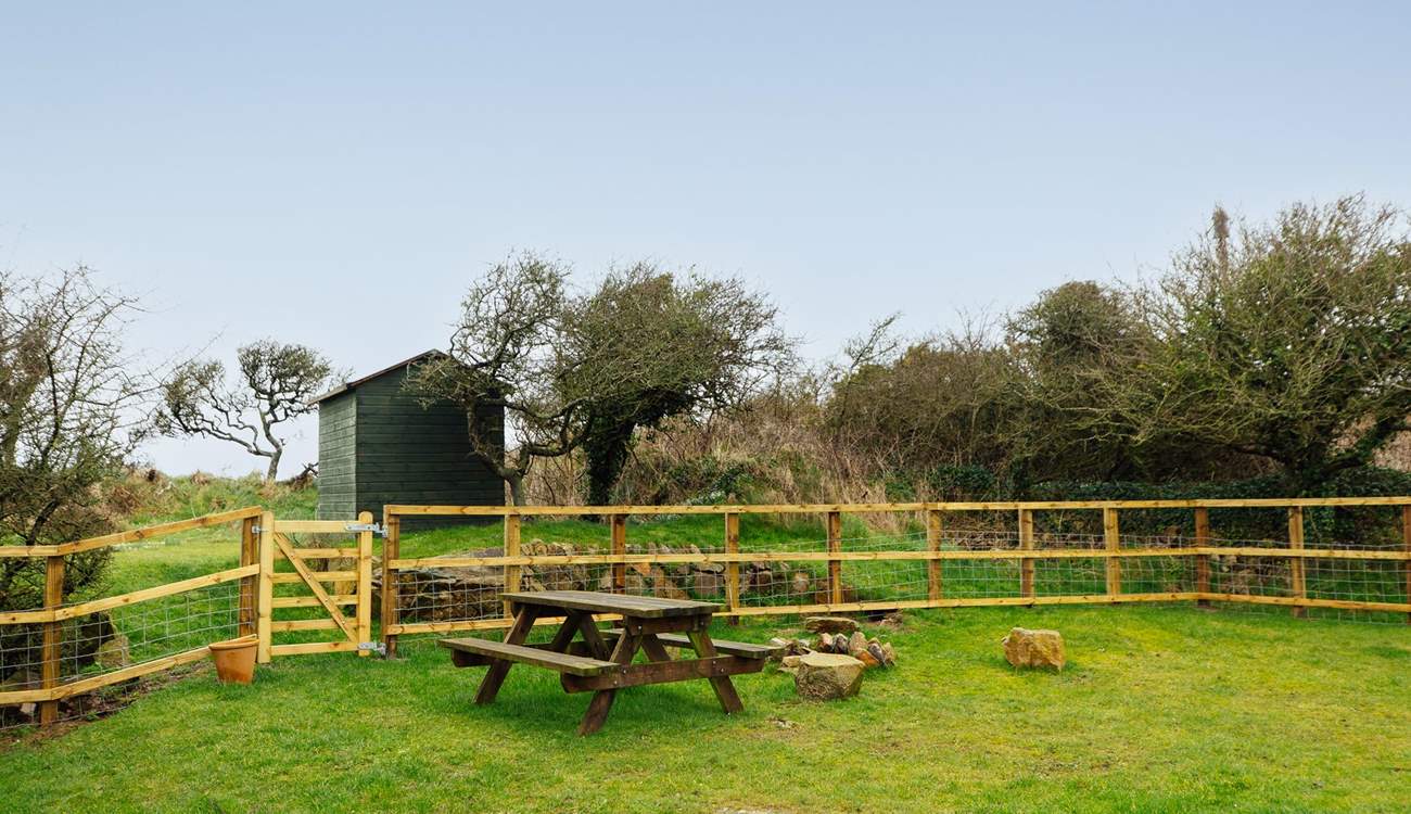 A fenced area, ideal for the dog, who is very welcome to stay at Pops Cottage. With so many beaches and walks nearby, he'll love it here!. 