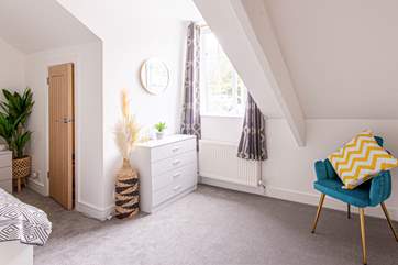 Enjoy a good book in this cosy corner.