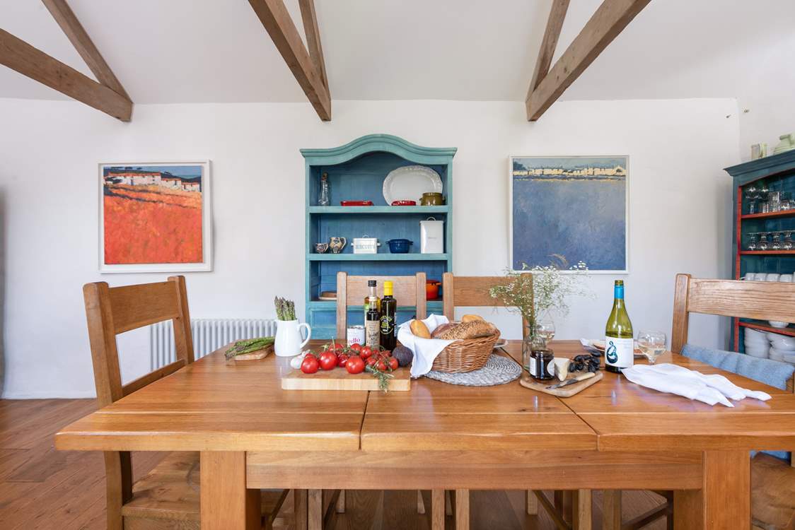 The charming farmhouse kitchen is perfect for informal suppers.