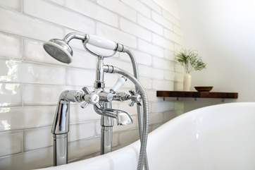 Treat yourself to a long leisurely soak in the gorgeous roll-top bath