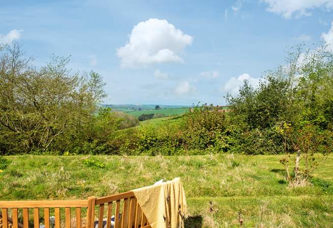 In the wild meadow garden and orchard the view is stunning and the garden bench has been positioned perfectly to take full advantage
