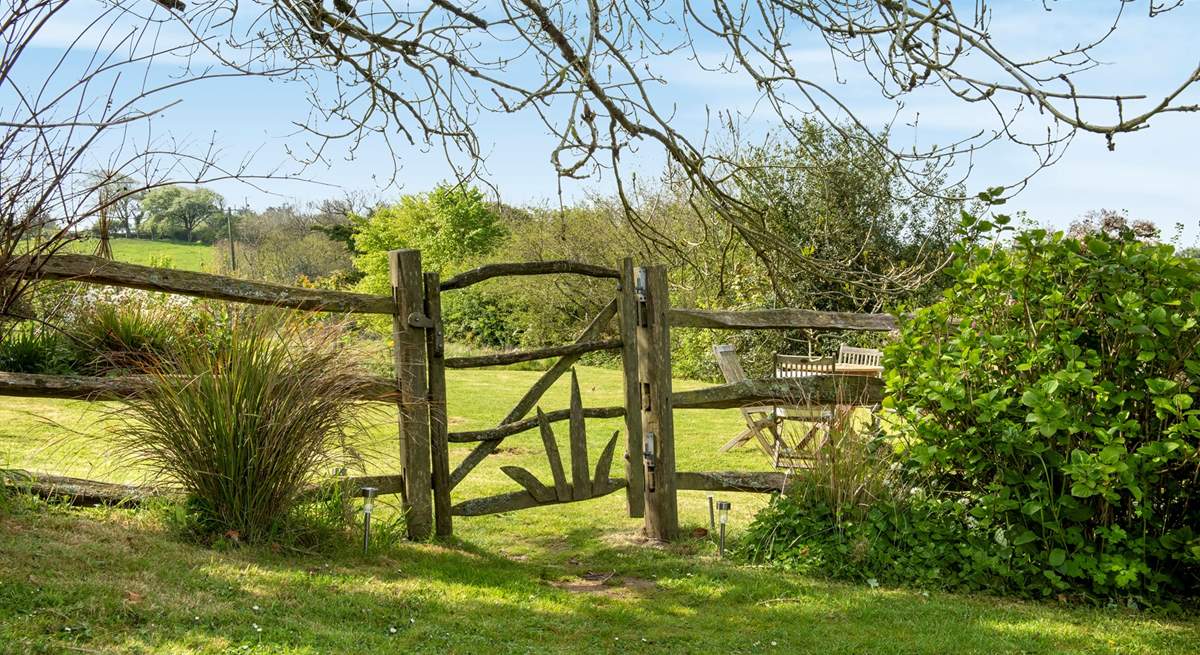 Step through the garden gate into the wild meadow garden and orchard