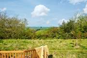 In the wild meadow garden and orchard the view is stunning and the garden bench has been positioned perfectly to take full advantage