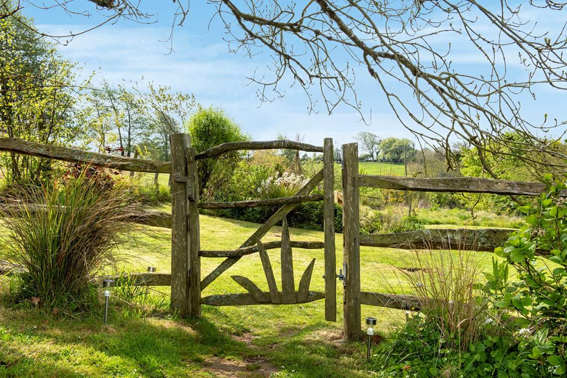 Step through the garden gate into the wild meadow garden and orchard