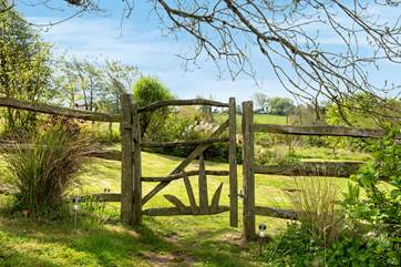 Step through the garden gate into the wild meadow garden and orchard