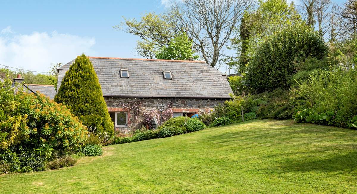 Bumblebee Cottage sits to the right-hand side of the property, one of a few barn conversions set around the original farm