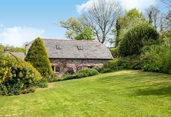 Bumblebee Cottage sits to the right-hand side of the property, one of a few barn conversions set around the original farm
