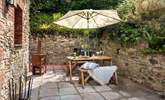 Your private terrace is very sheltered and the log-burner will keep you warm on chiller evenings - Thumbnail Image