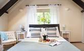 Lovely linen and gorgeous cushions adorn the beds - Thumbnail Image