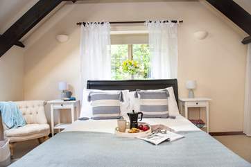 Lovely linen and gorgeous cushions adorn the beds