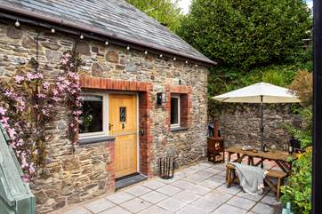 The sheltered terrace is the perfect spot for morning coffee leisurely holiday meals