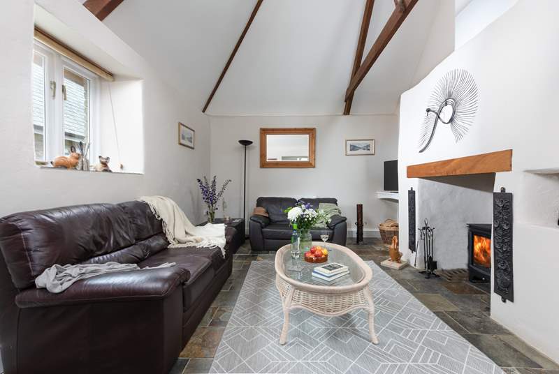 The sitting-room has lovely features and a wood-burner making this the perfect year-round retreat.